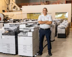 HGI Employee Standing in the Warehouse
